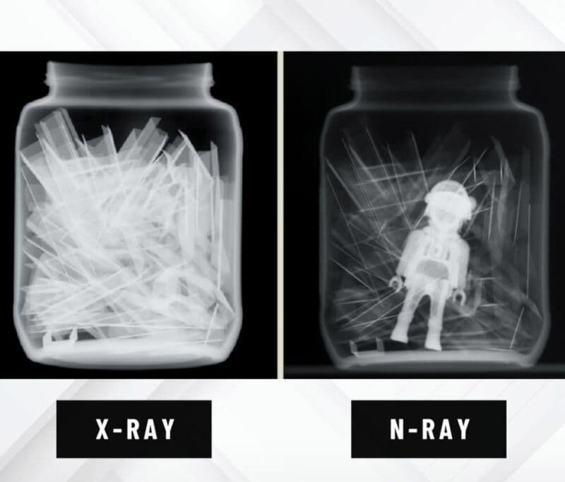 Two radiographs of the same jar of glass shards side by side, labelled X-ray and N-ray. The X-ray image shows only bright overlapping glass fragments; the N-ray image renders the glass nearly transparent and reveals a plastic toy figure standing inside the jar.